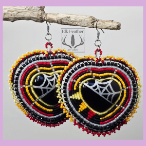 Ember Rays & Silver Webs Beaded Earrings featuring silver spiderweb heart cabochons, fiery red, orange, and yellow Delica beadwork with black leather backing.